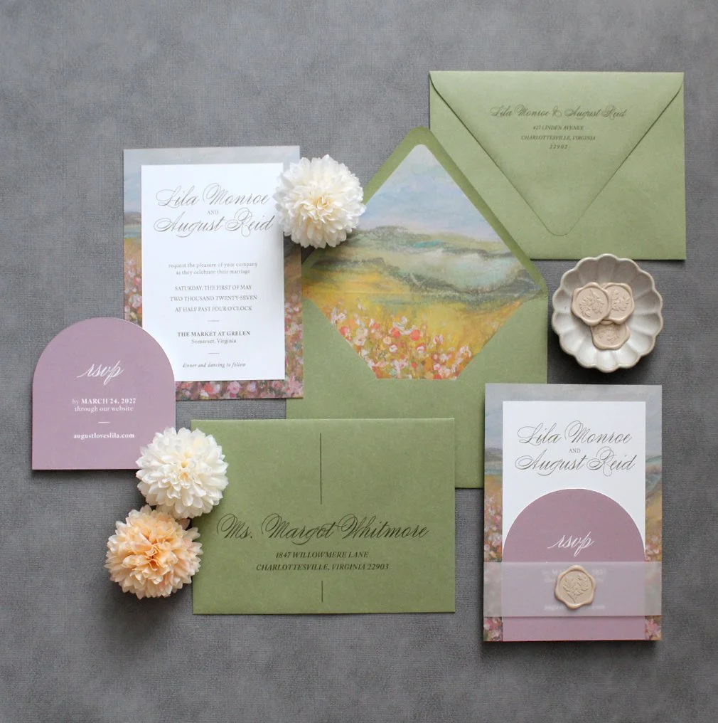 Custom green and blush wedding invitation suite with floral landscape artwork, envelope liner, RSVP card, wax seal, and calligraphy addressing for a romantic Virginia wedding.