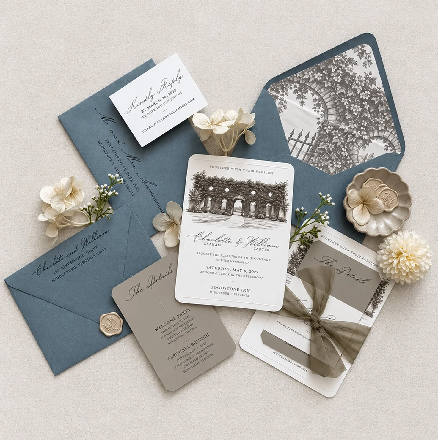 Custom blue wedding invitation suite for Goodstone Inn in Middleburg, Virginia, featuring venue illustration, envelope liner, RSVP and details cards, wax seal, and ribbon.