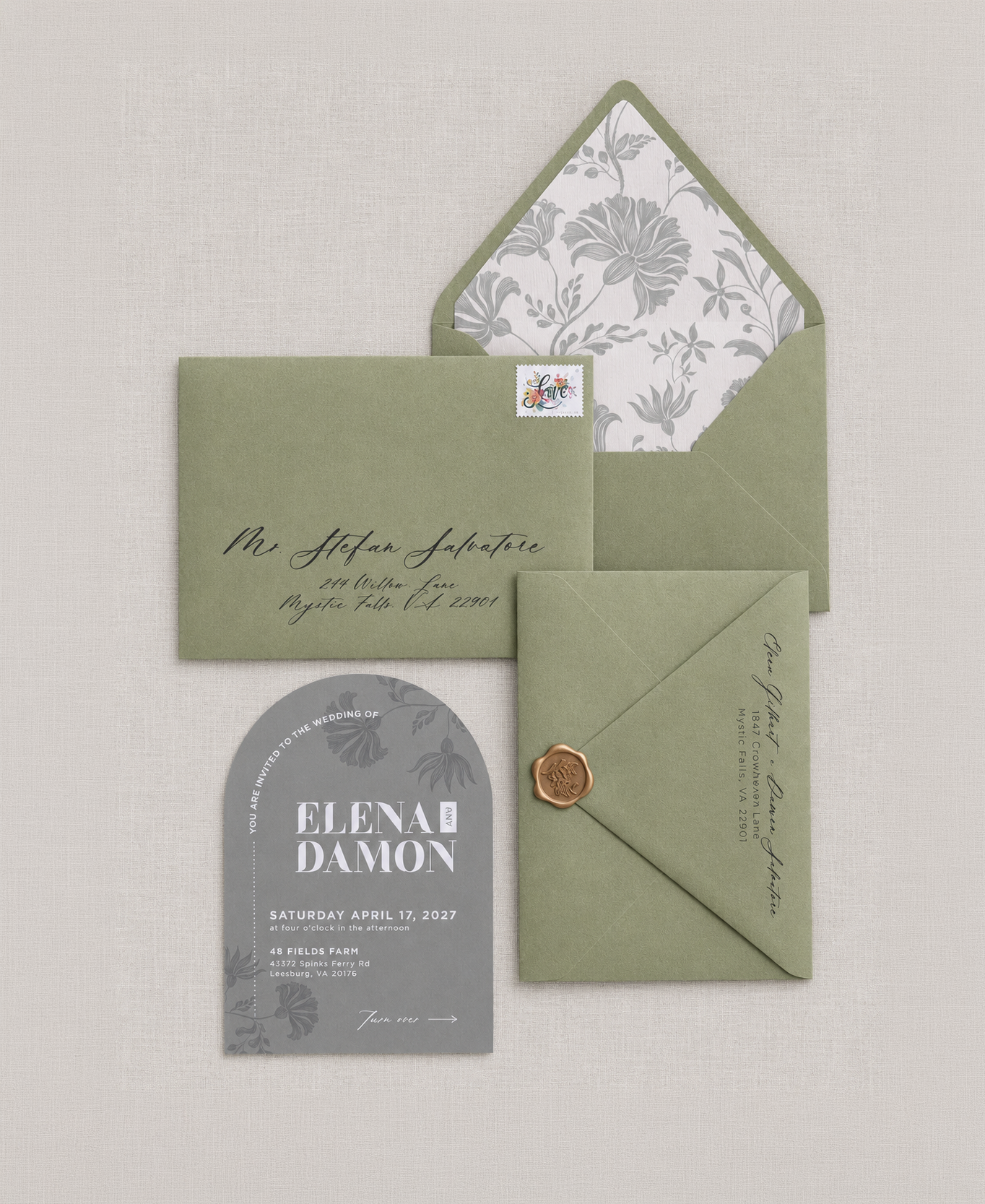 Elegant green wedding invitation suite with floral envelope liner, coordinating card and wax seal by Studio Amper.