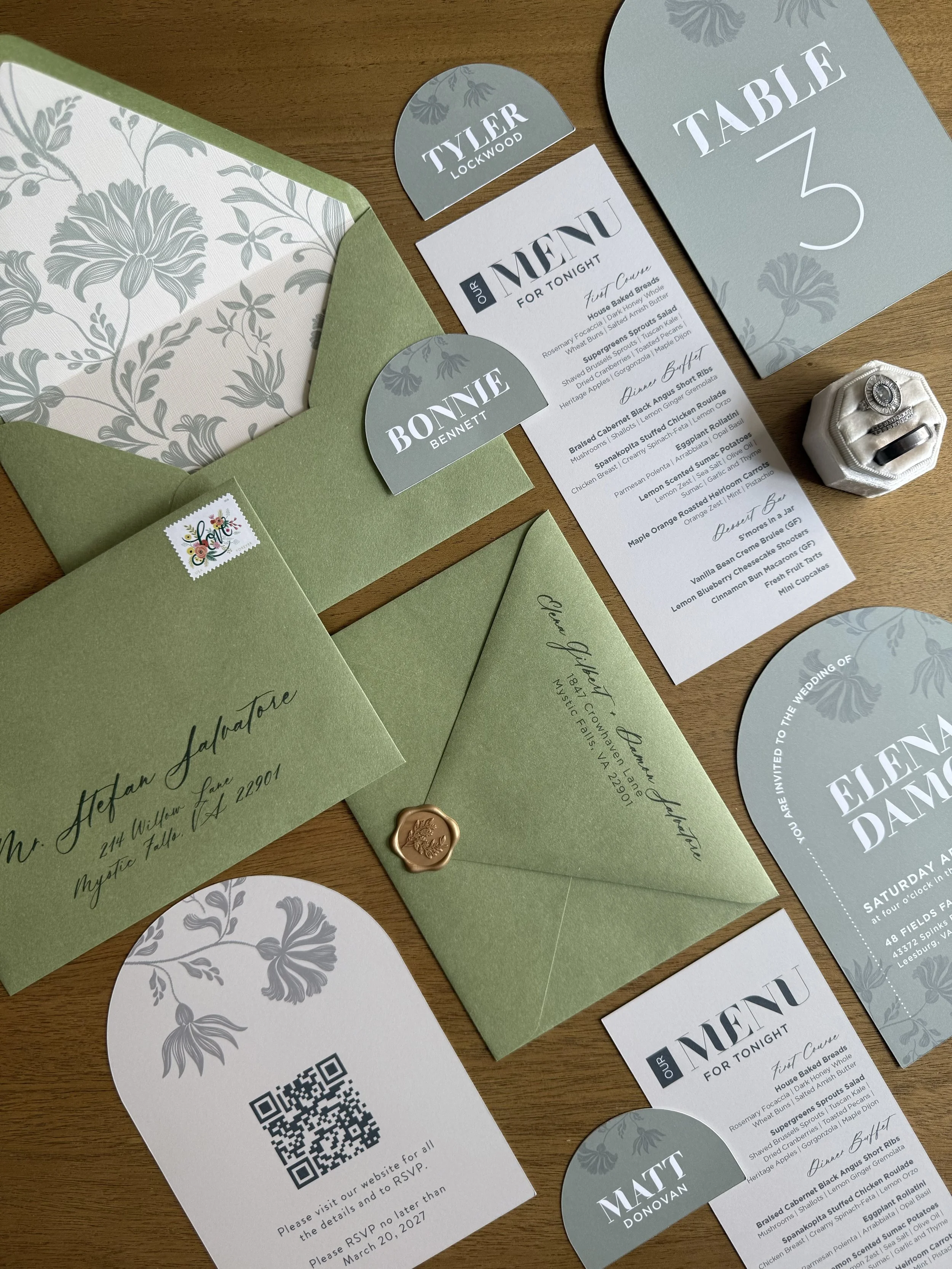 Semi-custom wedding invitation suite in sage green with botanical envelope liner, coordinating stationery and wax seal.