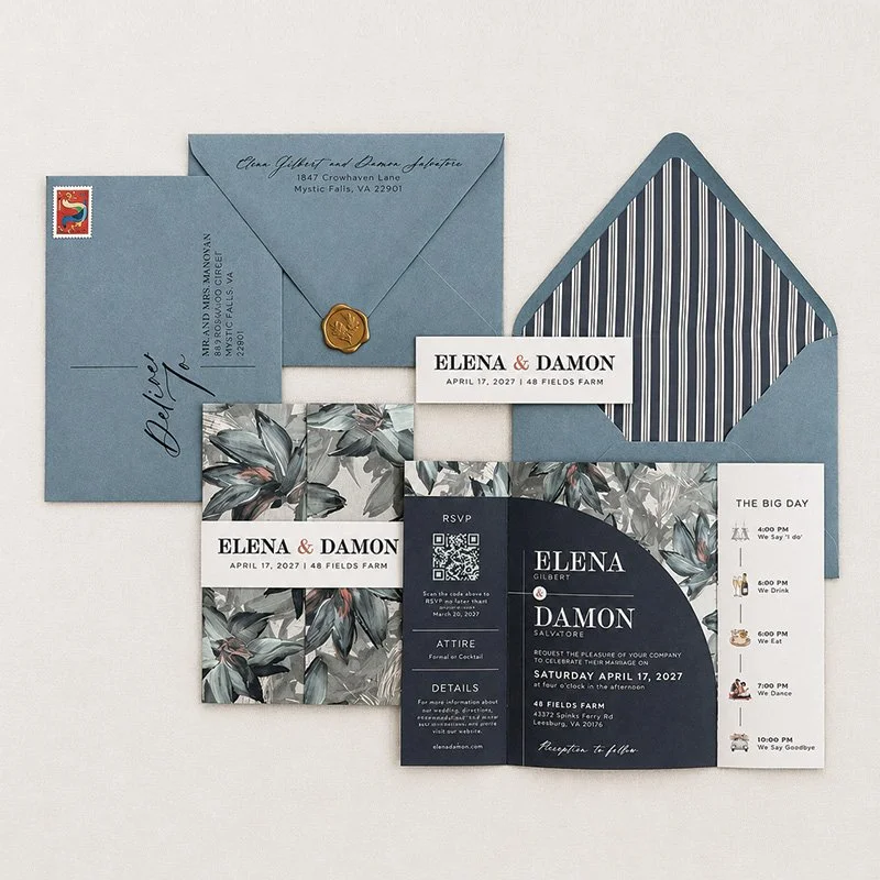 Blue-green wedding invitation suite with striped envelope liner, navy stationery, custom typography and coordinating paper details.