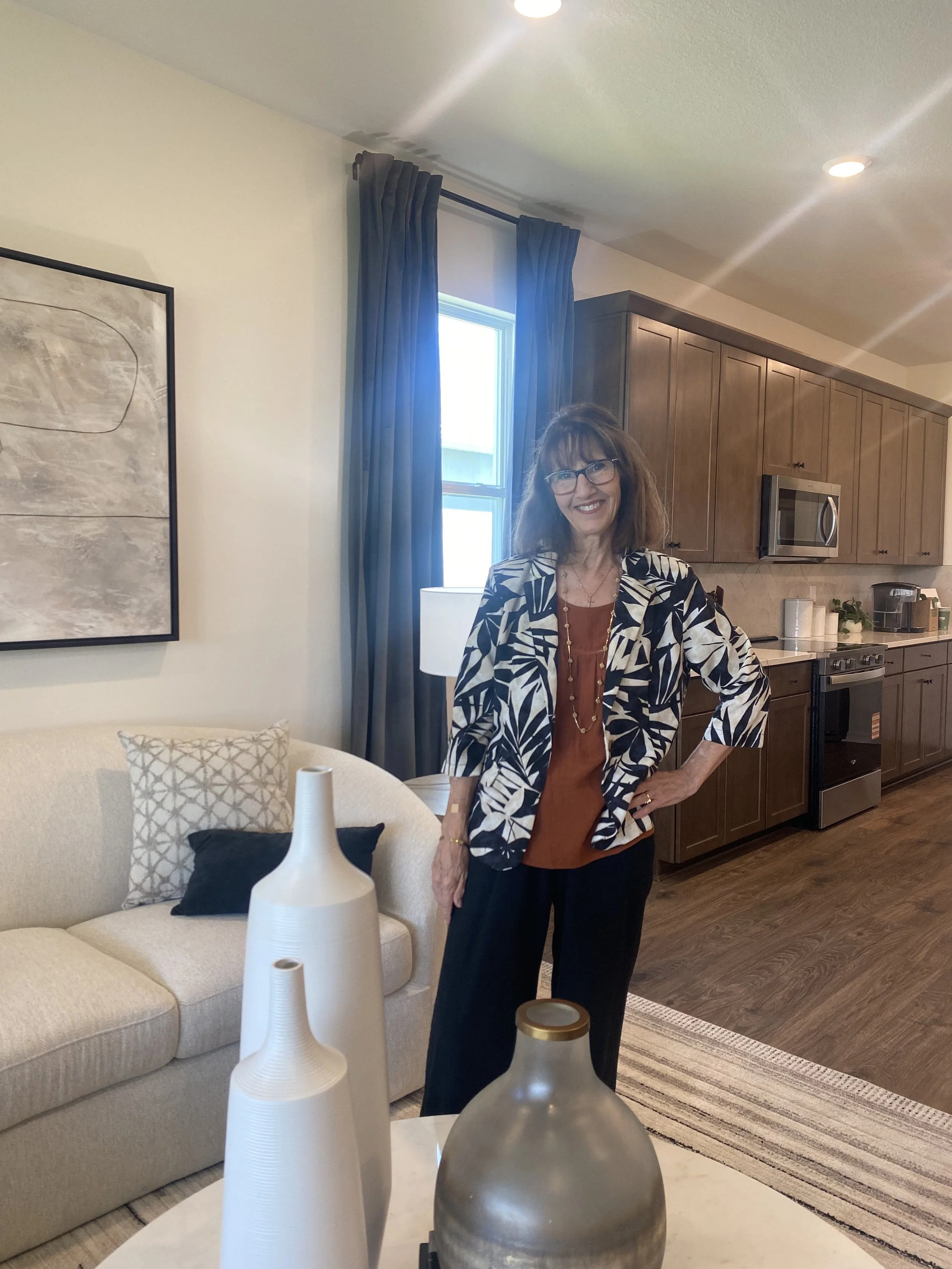 Angel Steusloff, of Set Above Staging & Design pictured at a model home at Dreamfinders Homes.