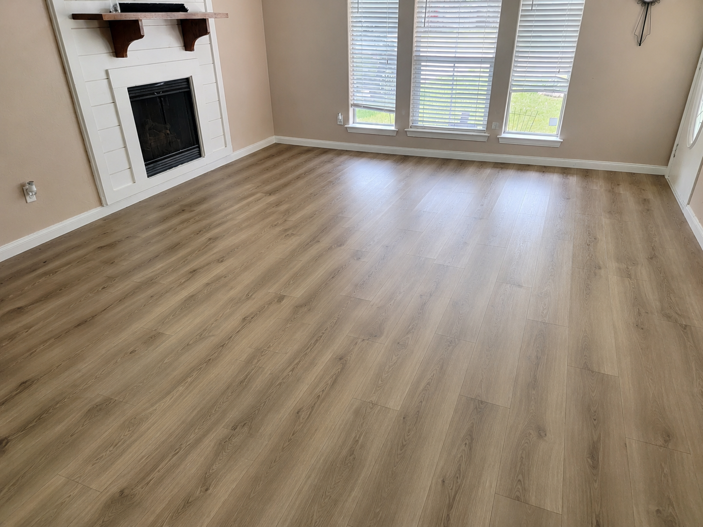 Finished vinyl wood flooring in a residential living room.