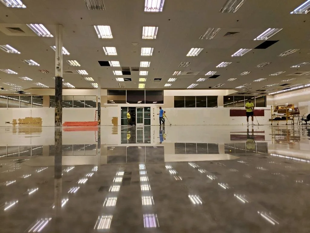 Polished concrete flooring in a large commercial space completed by The Brothers Shine.