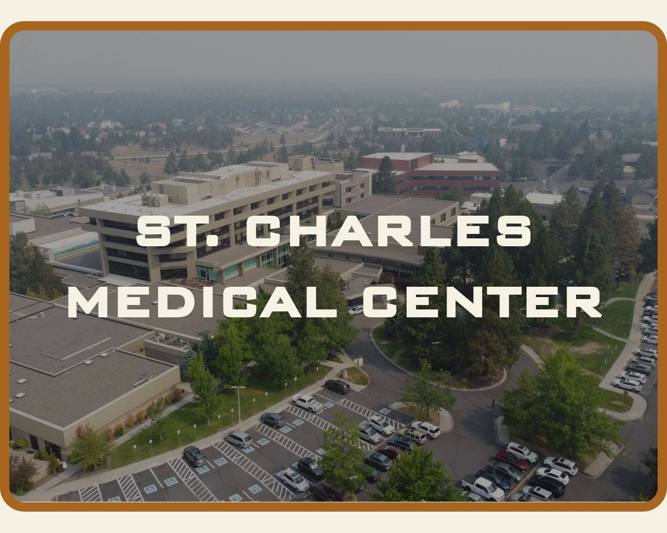 Aerial photo of St. Charles Hospital  roofs in Bend Oregon by McMurray and Sons Roofing Company