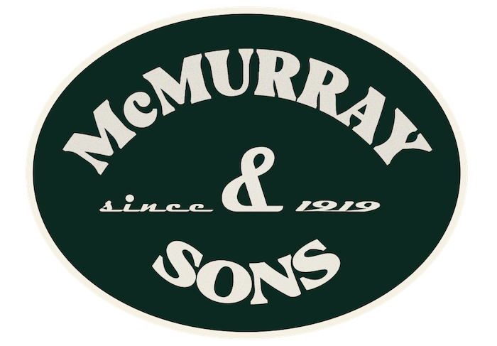 Logo with green background and white text reading 'McMurray & Sons since 1919' inside a white oval border.
