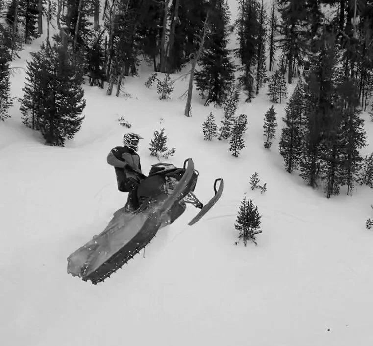 David McMurray II snowmobiling in the mountains
