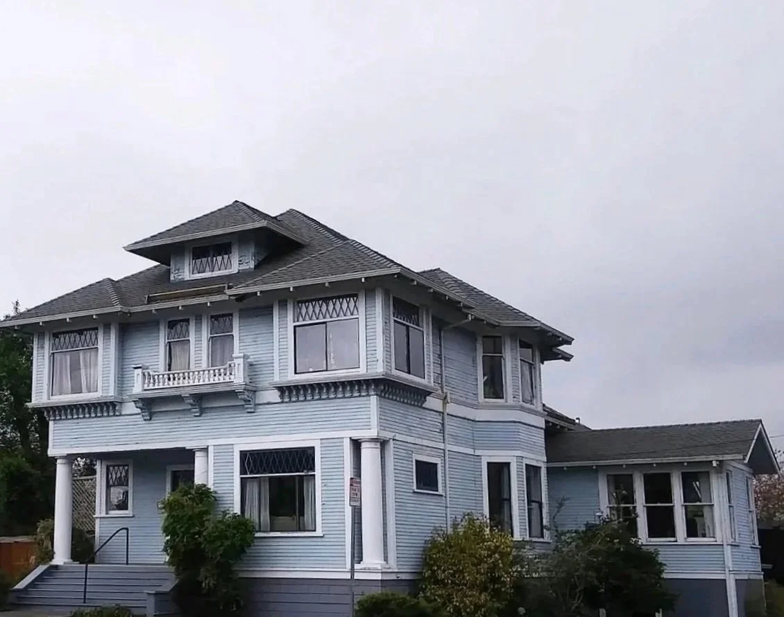 A victorian house with a new asphalt shingle roof in Eureka California