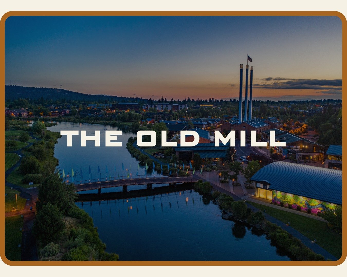 Aerial photo of the Old Mill District in dusk which is one of McMurray & Son Roofing customers
