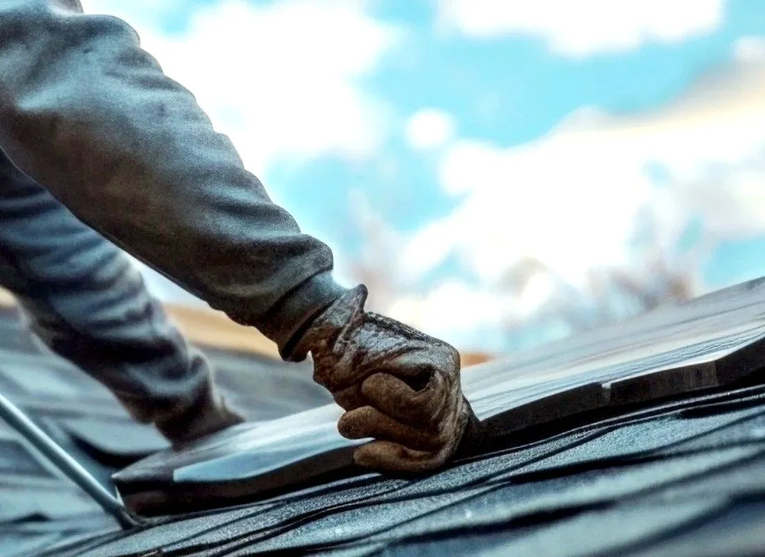 Roofer repairing a residential roof in Eureka, California