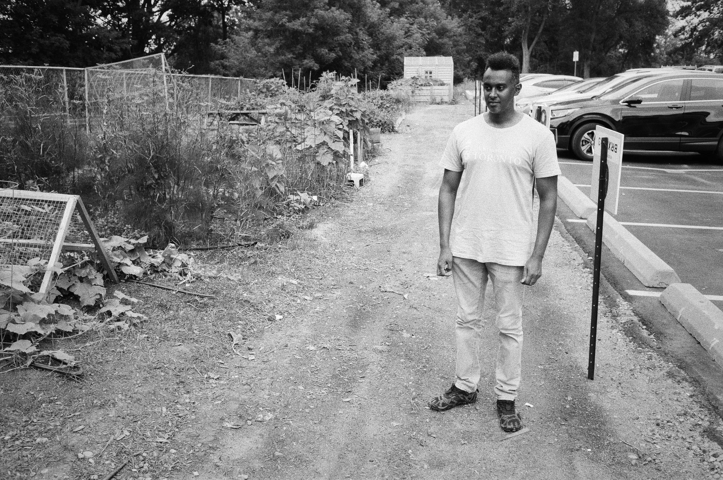 Sameer Benyan beside the community garden which is tended by residents of the Thorncliffe Park Drive housing complex.