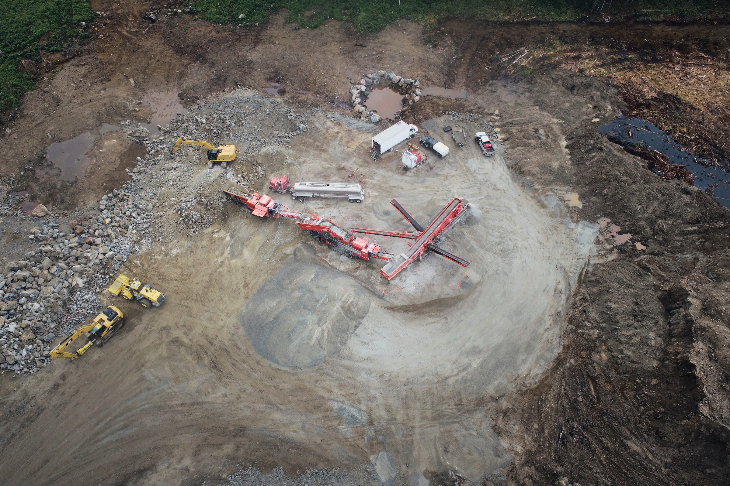 Aerial view of the crushing spread, excavators and stockpiles at Nouveau Monde Graphite, Saint-Michel-des-Saints.