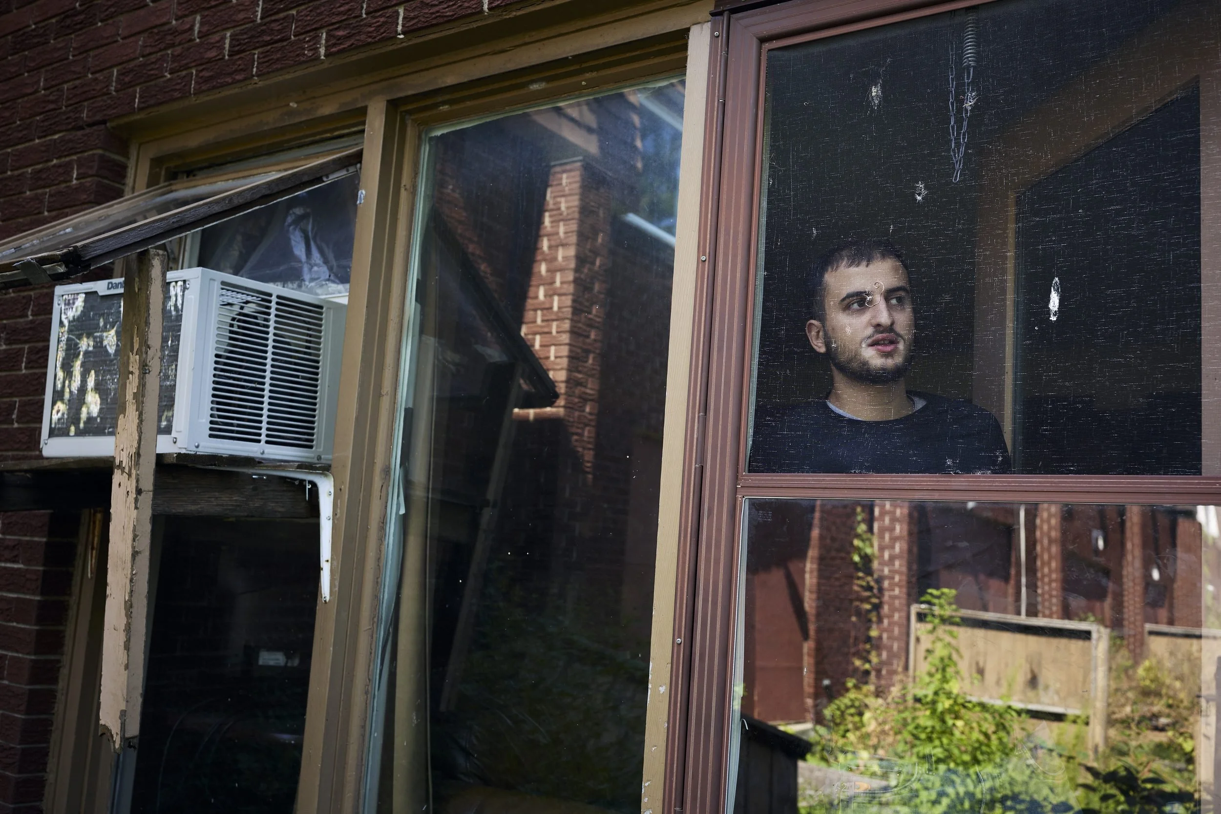 He gave his name as Muhammad Ali. He lives in one of the townhouse sections at Herongate. Many neighbouring houses are vacant. He said Hazelview promised him a new apartment after the area is redeveloped. He explained that many residents are very low