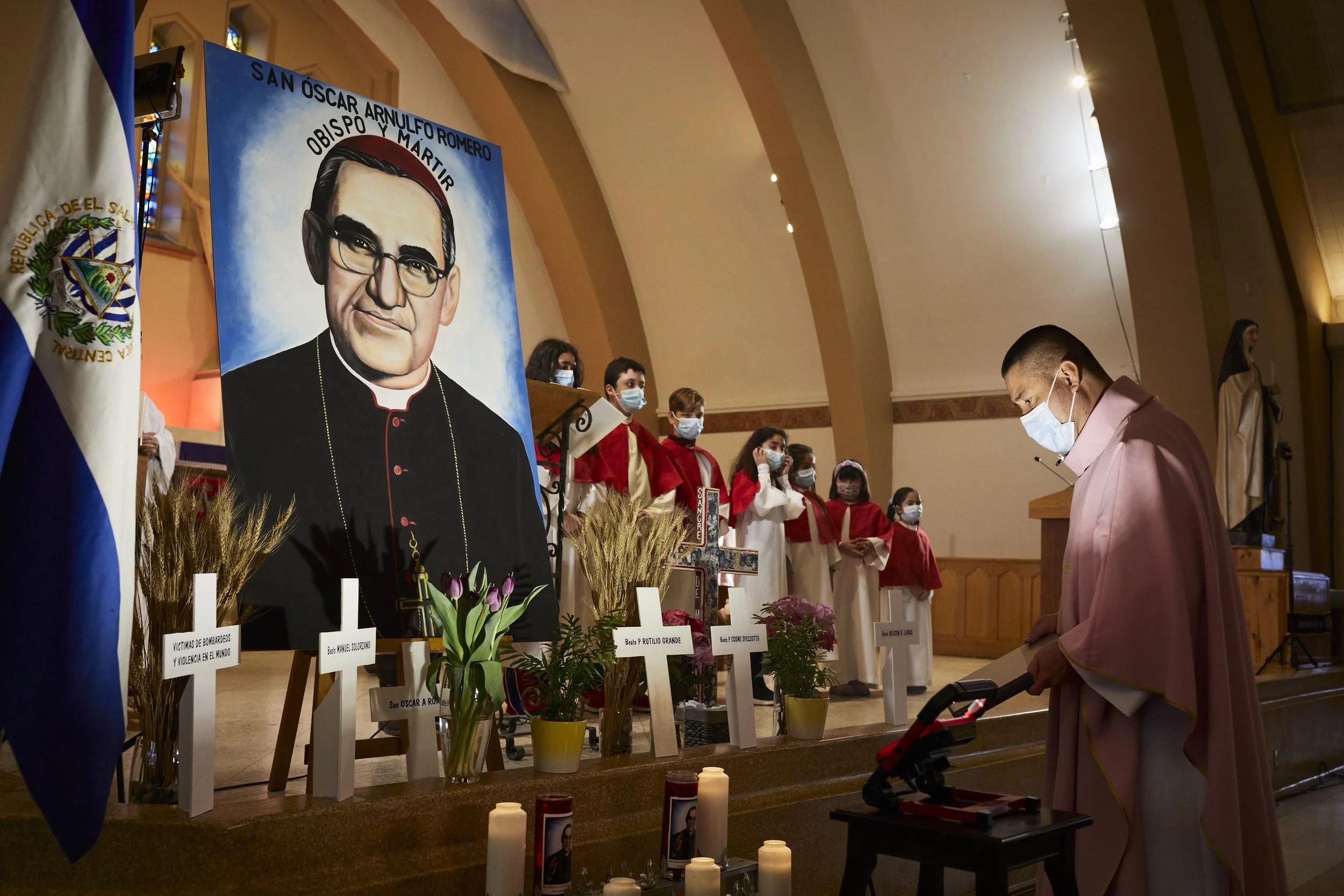 Members of Santa Teresa de Avila church hold a memorial to commemorate the assassination of Salvadoran bishop Oscar Romero at the hands of the military regime in 1980.