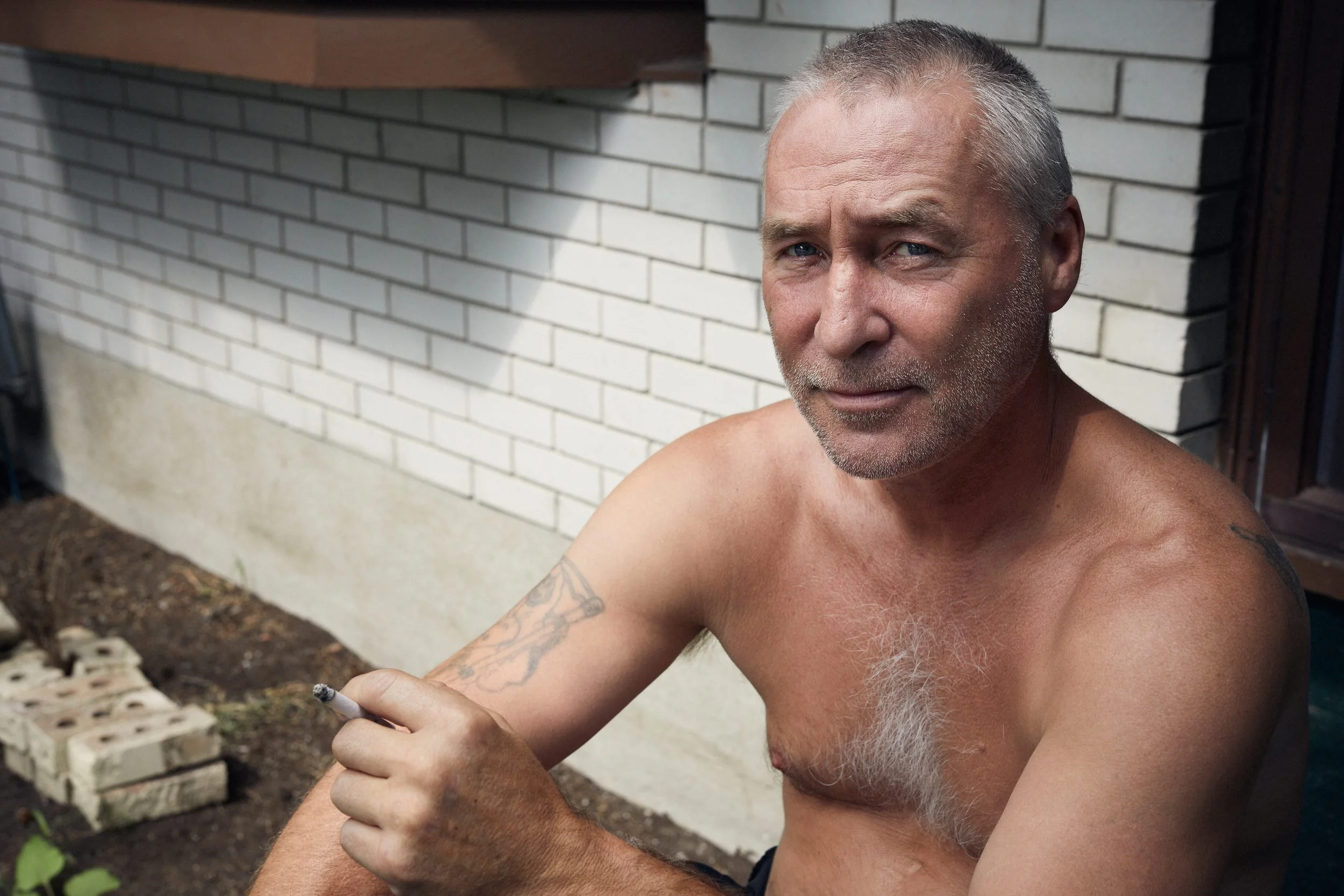 Jimmy Gerrior on his front porch at Heron Gate. He said he was leaving Ottawa after being notified that his home would be demolished.