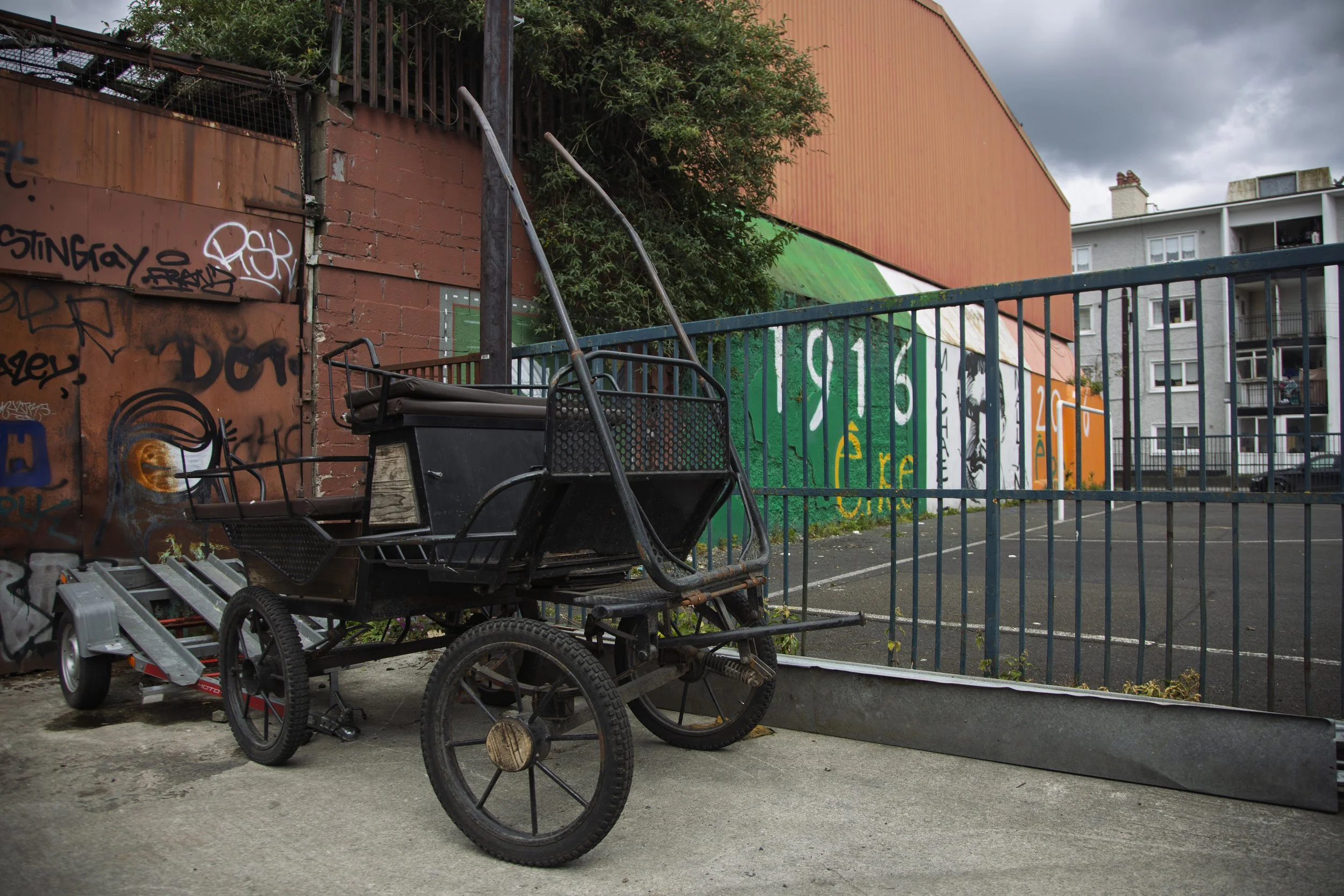 A horse-drawn carriage is left on the side of the street in an alleyway in Dublin, Ireland on May 15, 2026.
