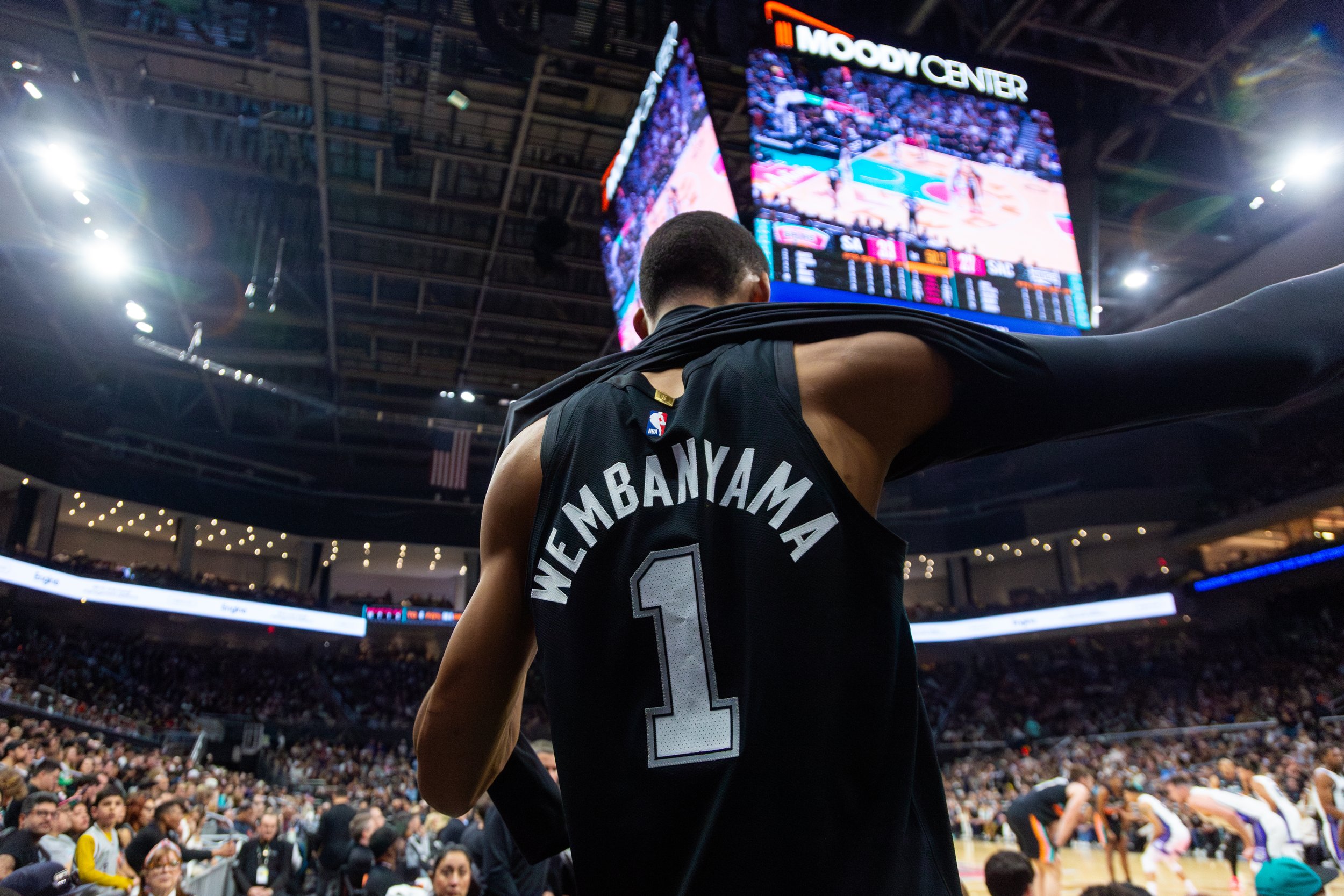 Victor Wembanyama comes off the court and puts on his warm up shirt during the San Antonio Spurs 1-35 series at a game against the Sacramento Kings on Feb. 21, 2026. The Spurs defeated the Kings with a final score of 139-122, Wembanyama put up 28 poi