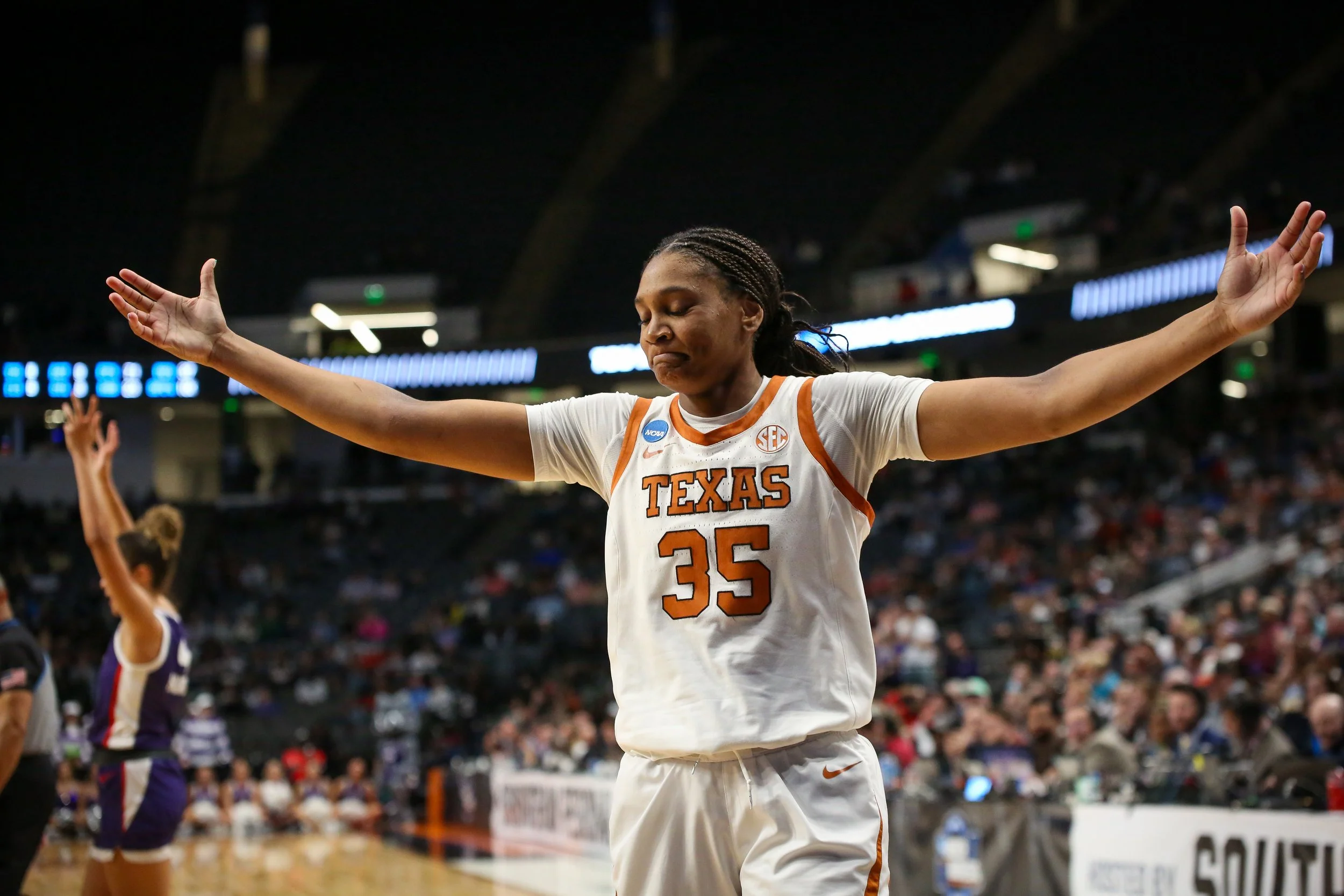 Forward Madison Booker embraces the applause from the stadium after getting a foul against the TCU Horned Frogs during the Elite Eight game in Birmingham, Alabama on Mar. 31, 2025. Booker put up 18 points for the Longhorns and won with a final score 
