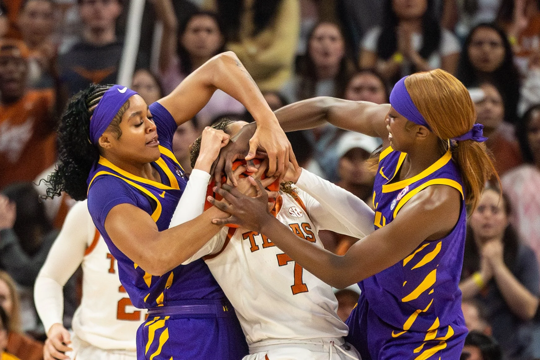 Guard Jordan Lee fights to keep possession of the ball with two LSU players during a game at Moody Center on Feb. 5, 2026.