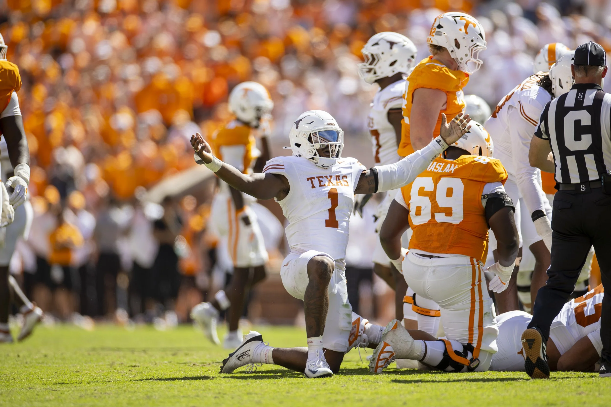 Junior edge rusher Colin Simmons raises his arms in celebration after his fifth sack of the game against Tennessee at Neyland Stadium on Sept. 26. The Longhorns defeated the Vols with a final score of 20-17, returning to Tennessee for the first time 
