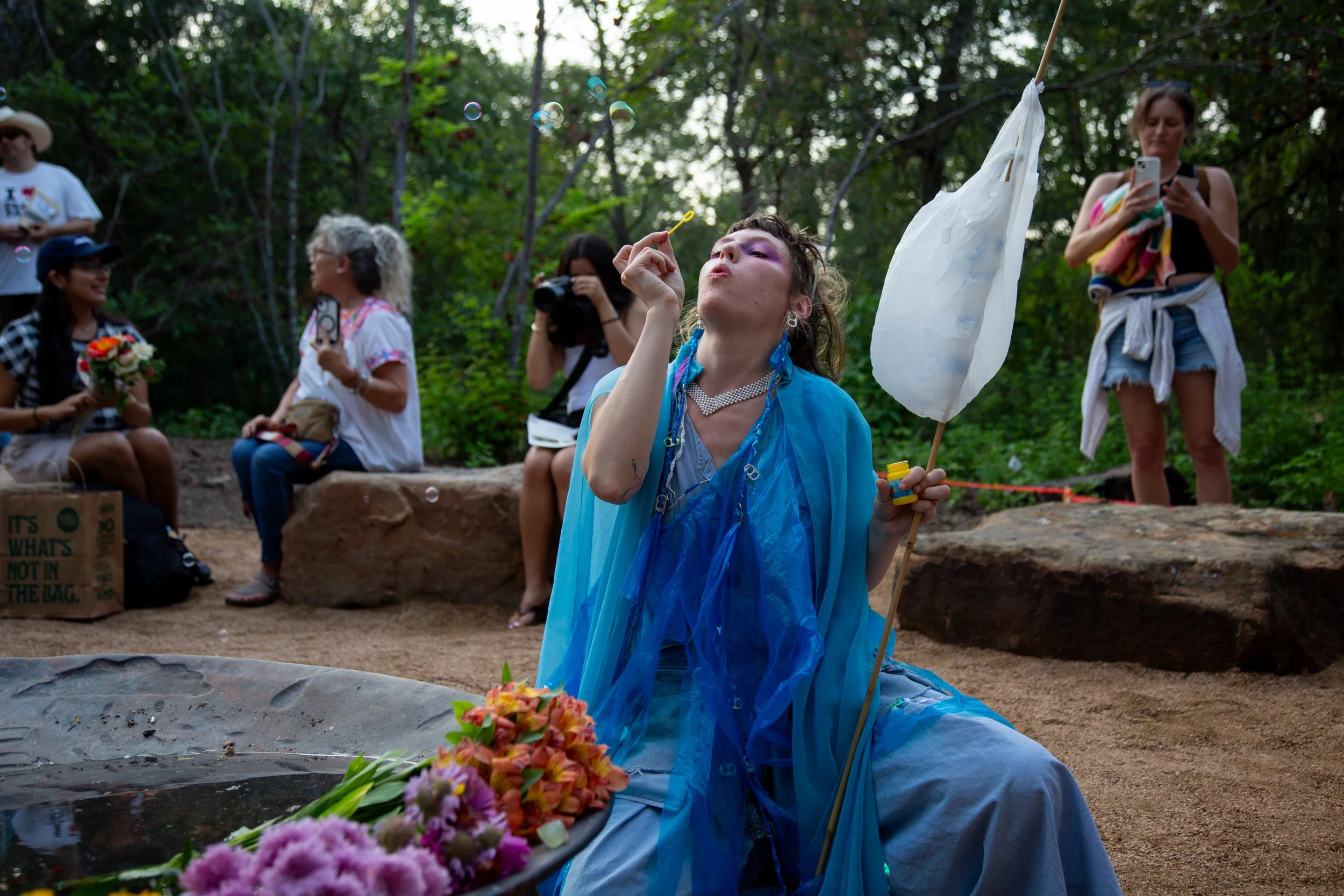 Love blows bubbles at Malin’s memorial service in Pease Park on Wednesday, June 24, 2026.