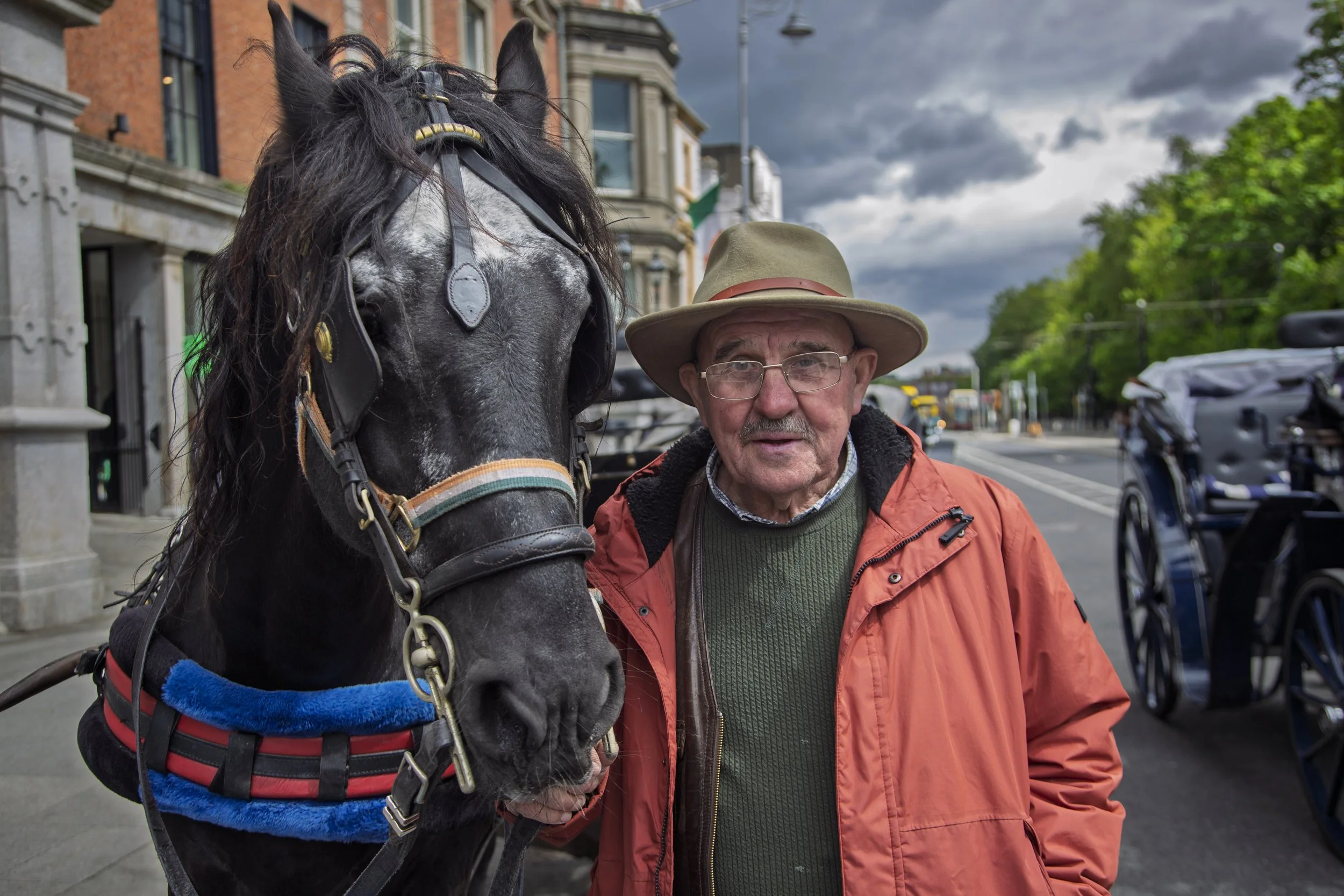 Patrick, a horse-drawn carriage business owner, poses for a portrait with his horse in St. Stephen's Green, Dublin, Ireland on May 15, 2026. Patrick claims that most of the tourist businesses in Dublin keep their horses in shared stables.