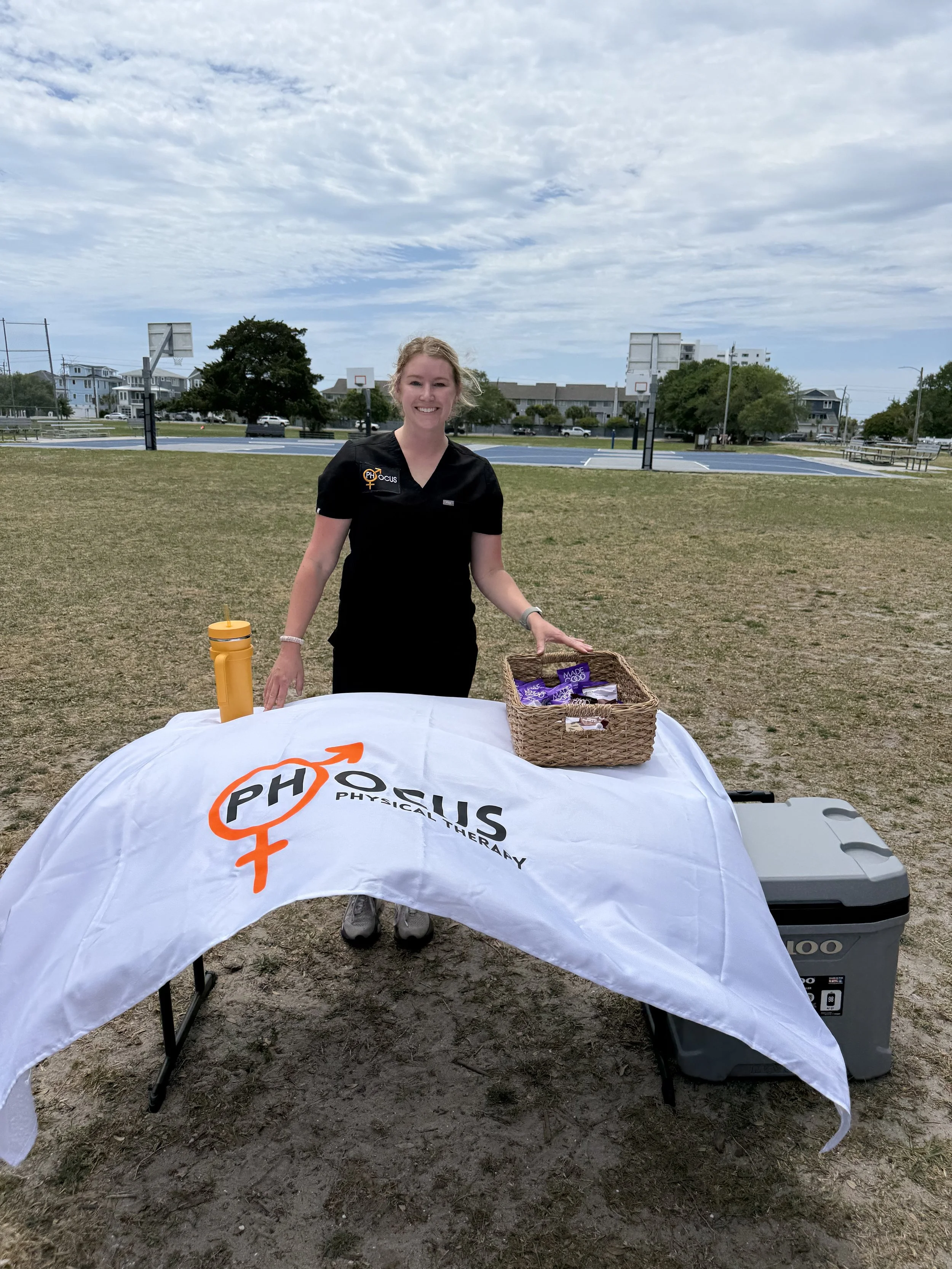 Hailey Colbert, pelvic floor physical therapist and owner of Phocus Physical Therapy, participating in a community event with sip and stroll moms club in Wilmington, NC.