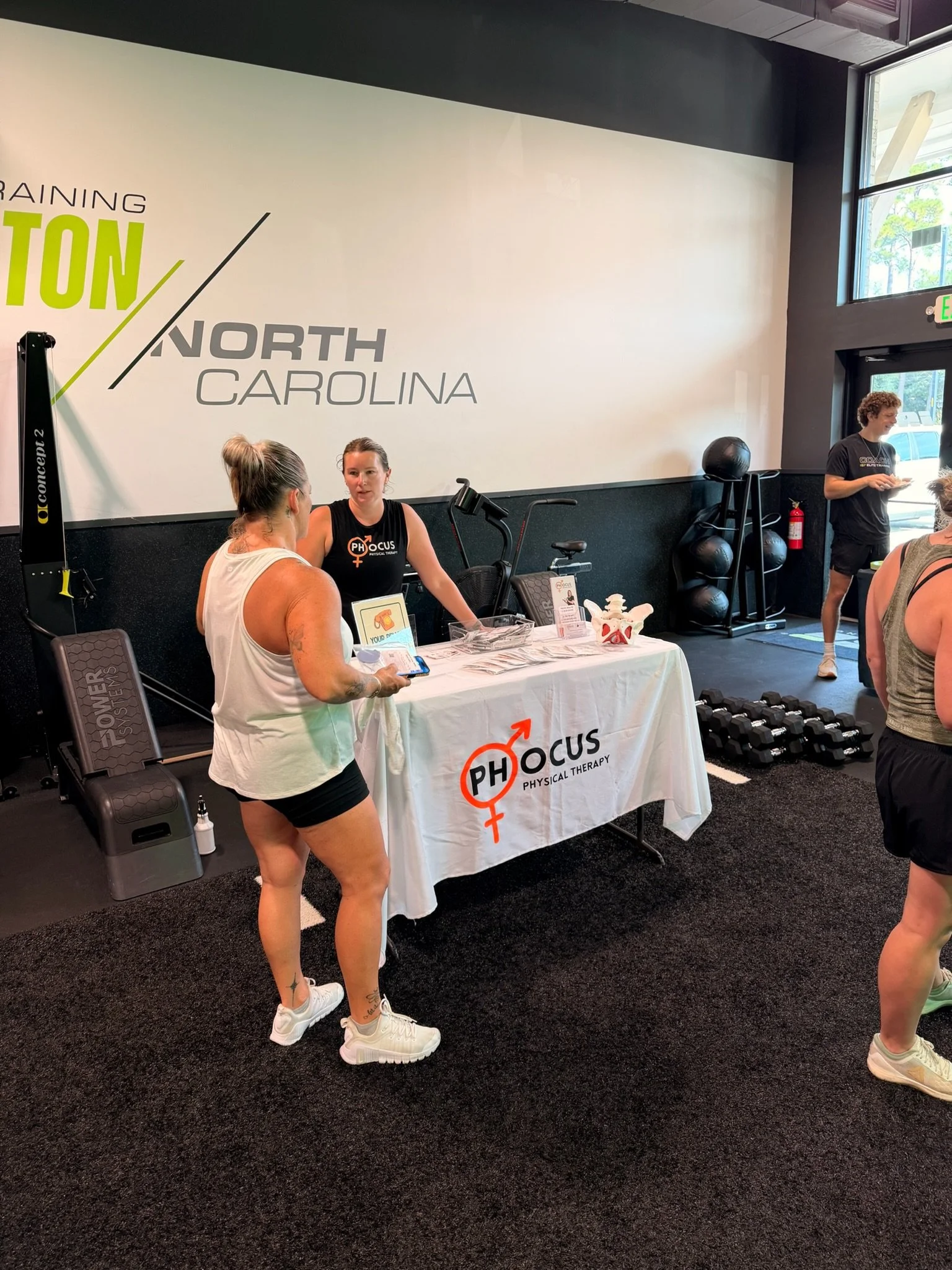 Hailey Colbert, pelvic floor physical therapist and owner of Phocus Physical Therapy, participating in a community event in Wilmington, NC.