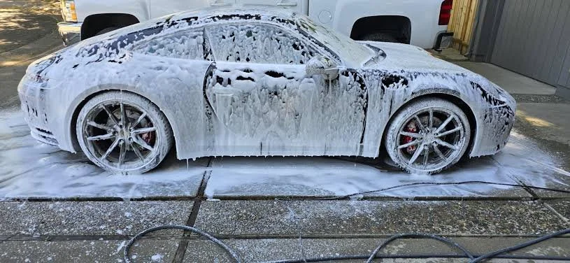 a car that was covered in foam as a prep step of detailing the exterior clean