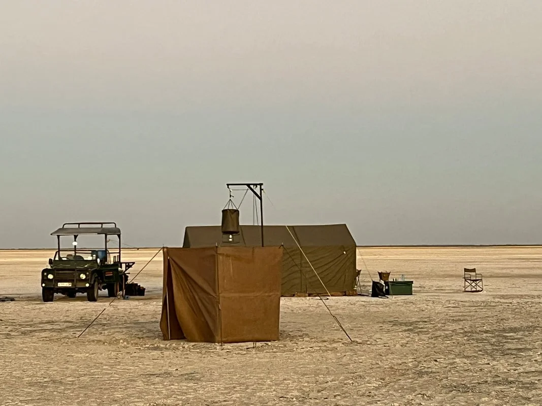 Mobile safari camp with an outdoor bucket shower on the Makgadikgadi Salt Pans, Botswana.