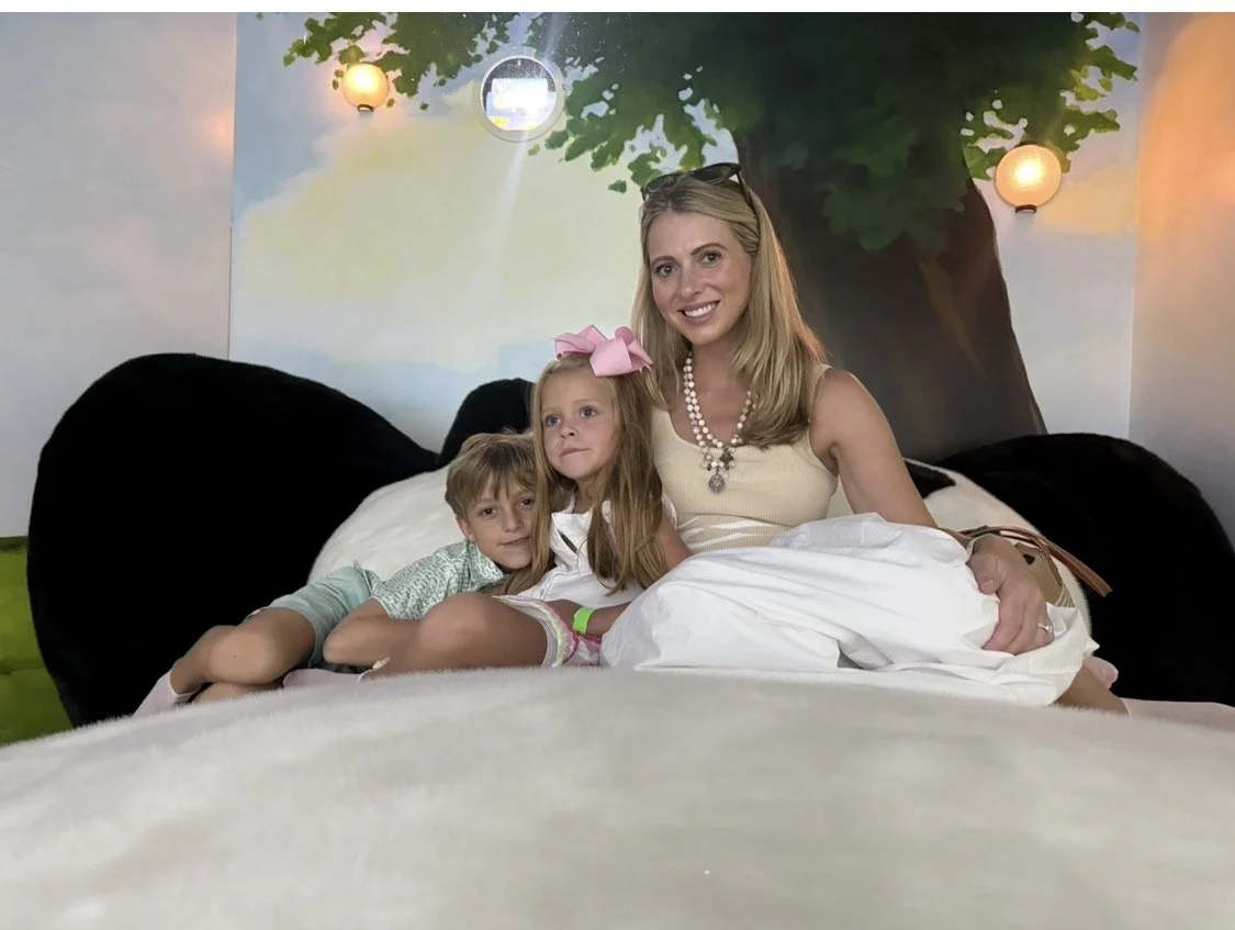 A mother exploring the Rabbit hOle in North Kansas City with her two children.