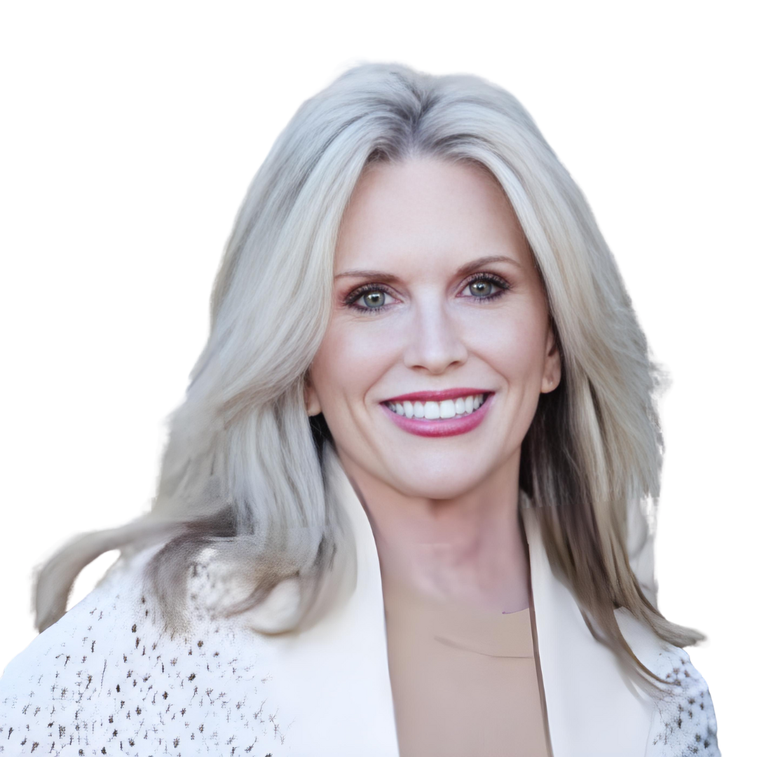 Vicki Ferguson, Kansas City REALTOR®, smiling in a white blazer.