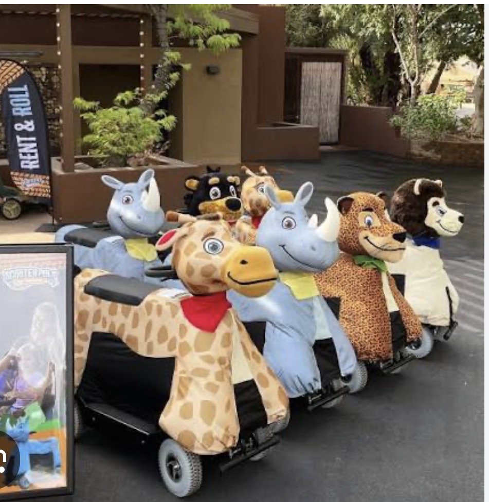 Colorful animal scooters at the Kansas City Zoo, a fun family favorite.