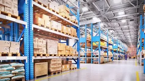 Warehouse aisle with blue metal shelving units filled with boxes and packages