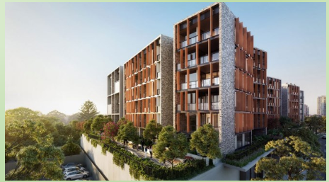 Modern multi-story apartment complex with brick and concrete exterior, surrounded by green trees and parked cars.
