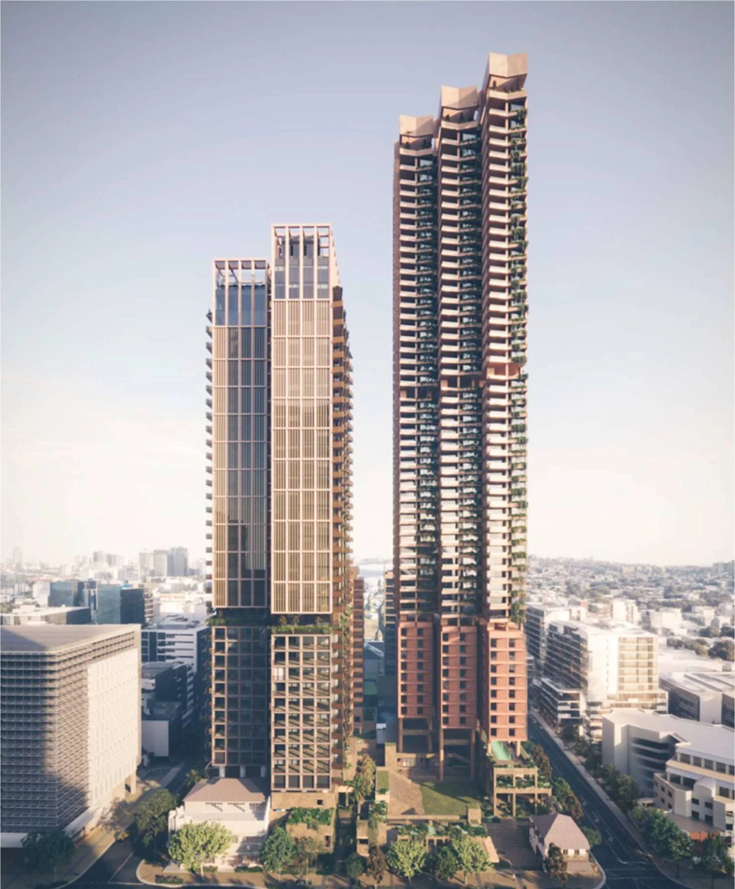 High-rise skyscrapers under construction in an urban cityscape, with a clear sky in the background.