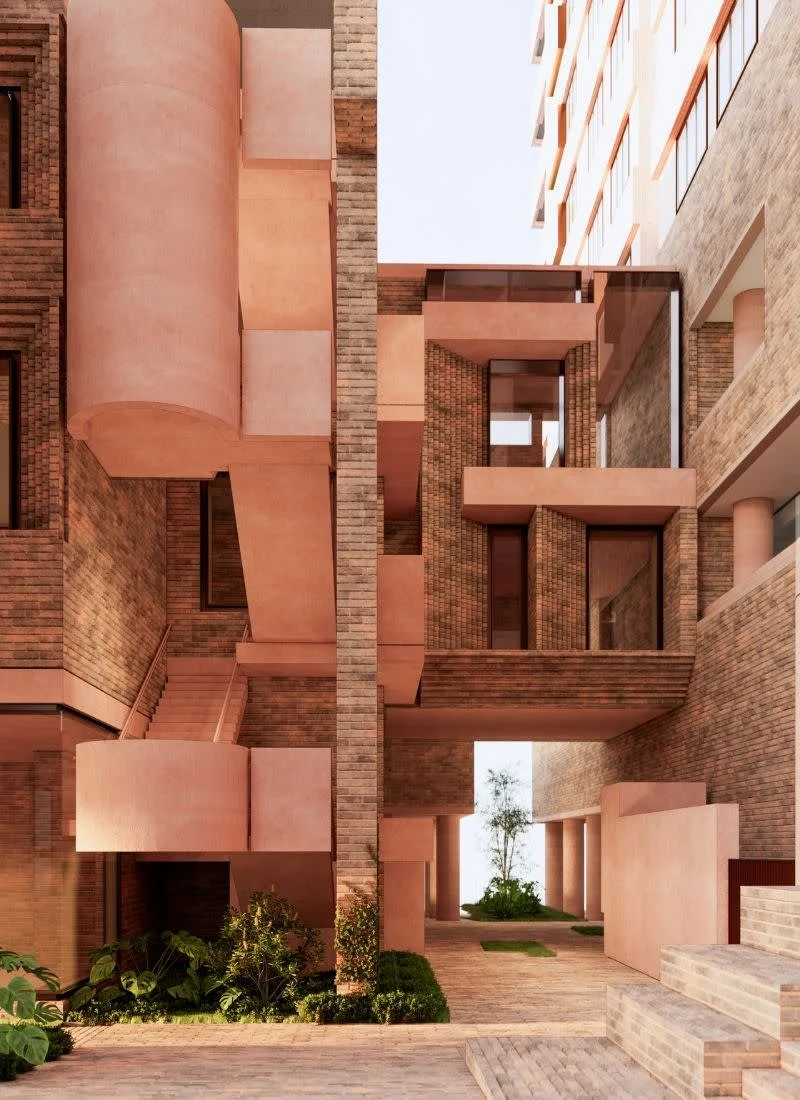 Modern multi-story building with pink and brick exterior, featuring balconies, large windows, and a courtyard with plants and trees.