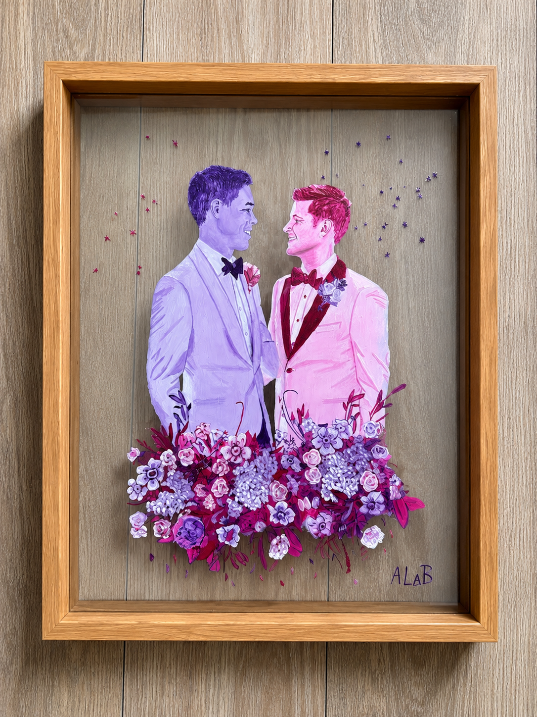 Custom wedding portrait painted on glass, featuring two newlywed men surrounded by colorful flowers and transparent negative space.