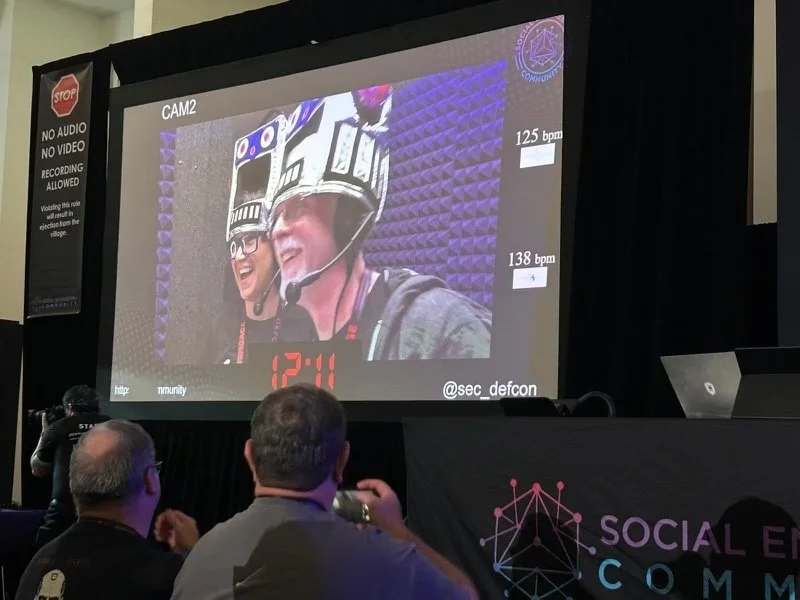 Perry Carpenter and Lisa Flynn competing at the Battle of the Bots competition at DEFCON.