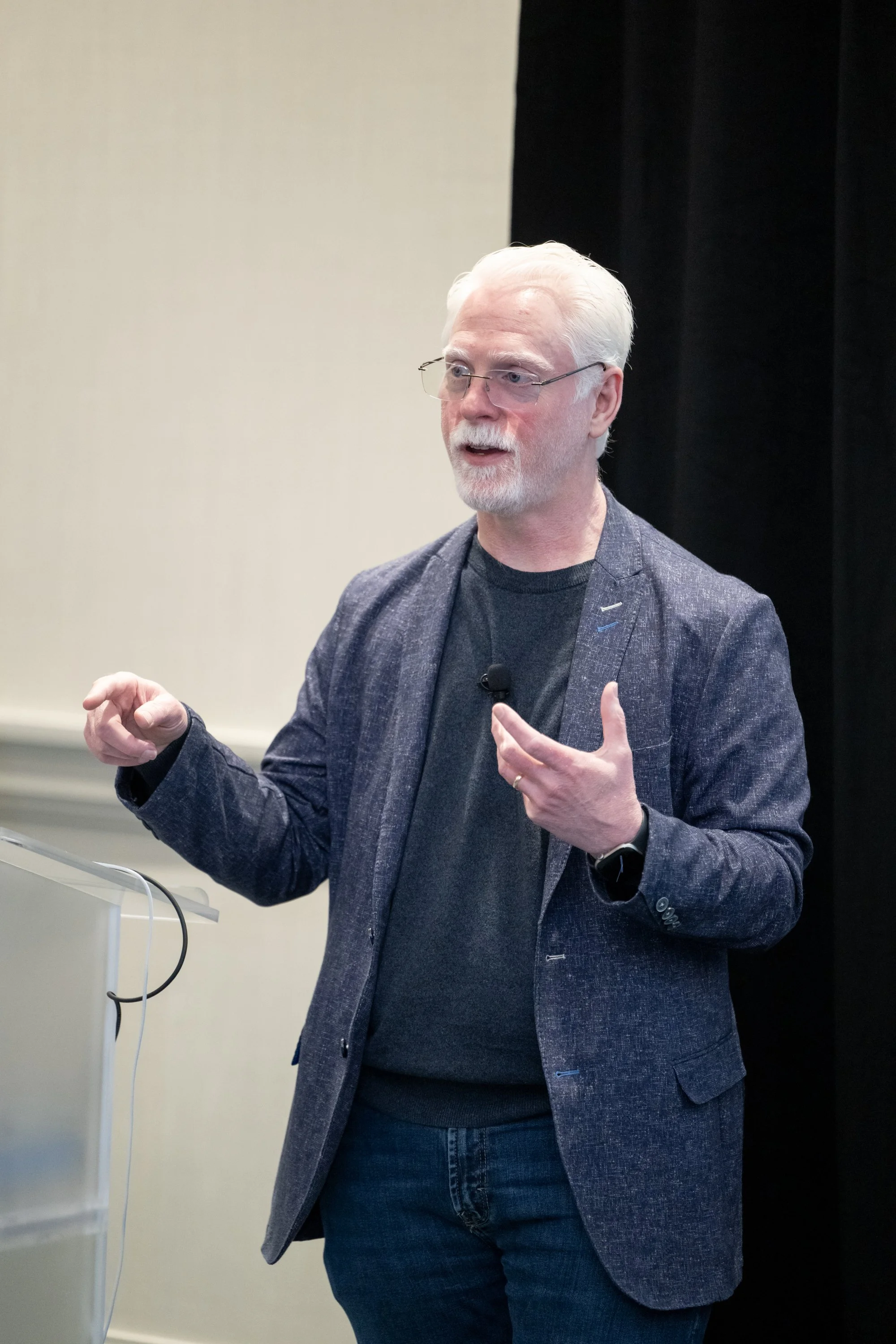 Perry Carpenter giving a presentation in a conference room.