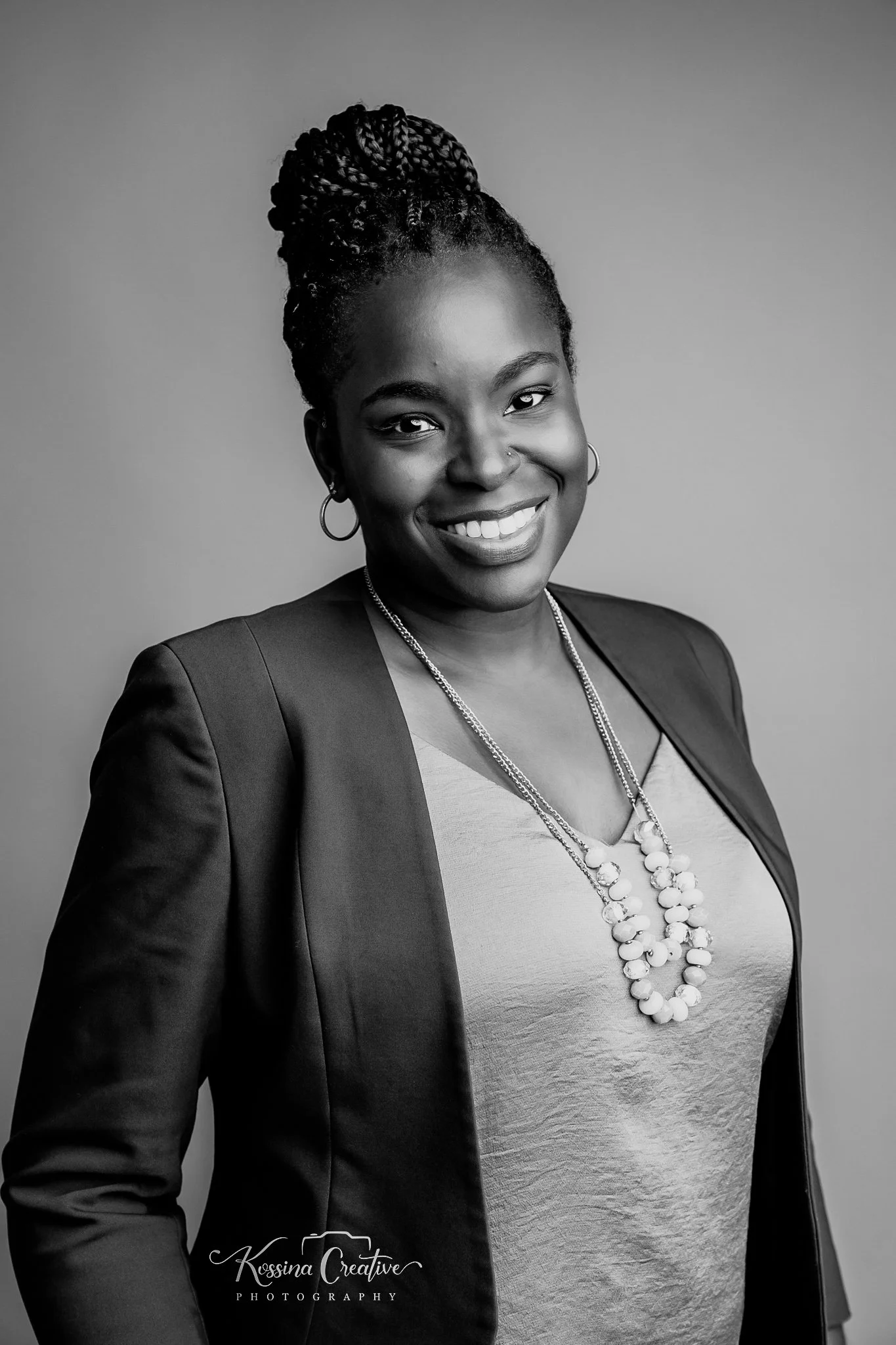 Black-and-white portrait of Candace Jackson, Founder and Managing Principal of Kenroe Advisory.