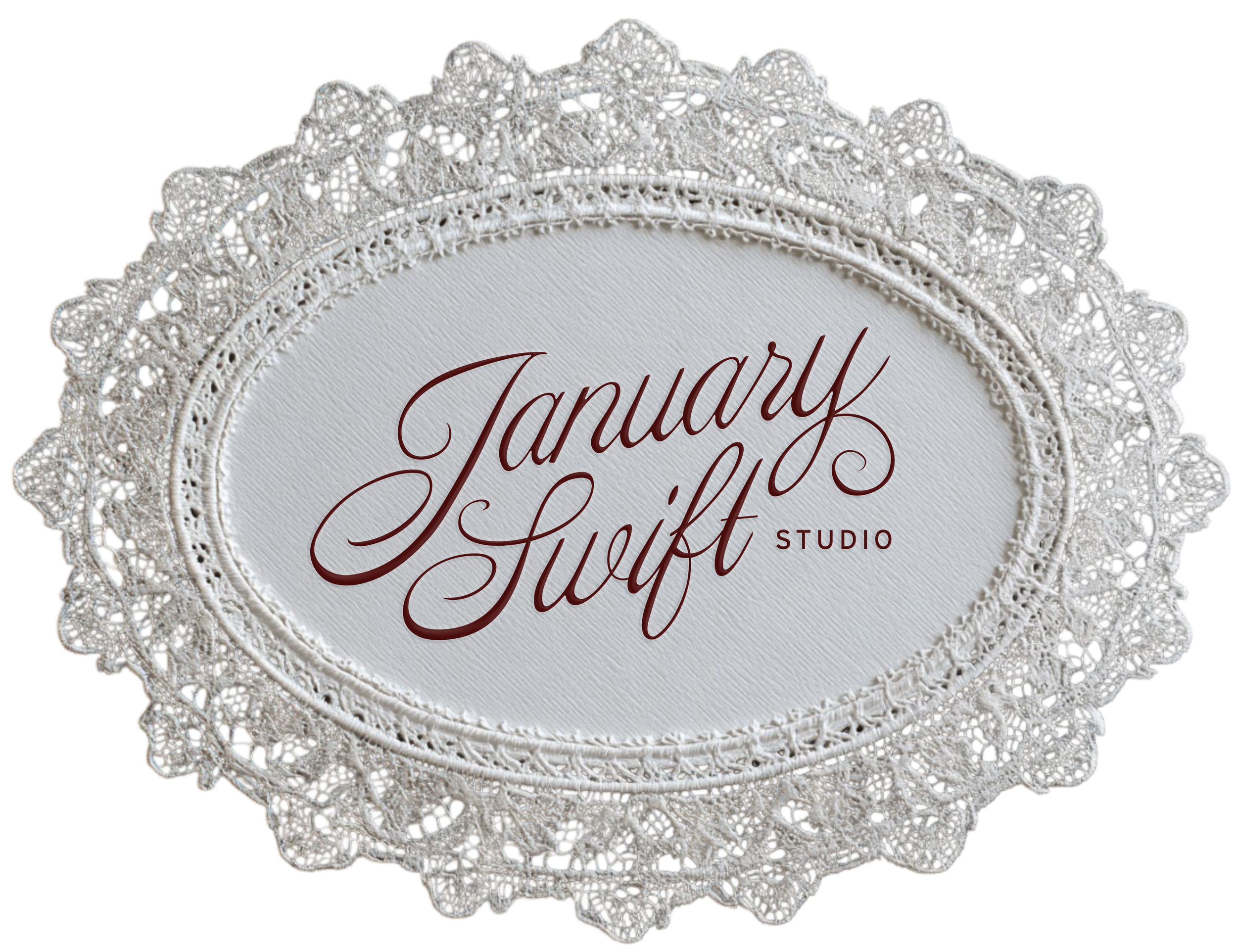 A horizontal oval lace frame with elegant, red script writing in the center that says, 'January Swift Studio'.