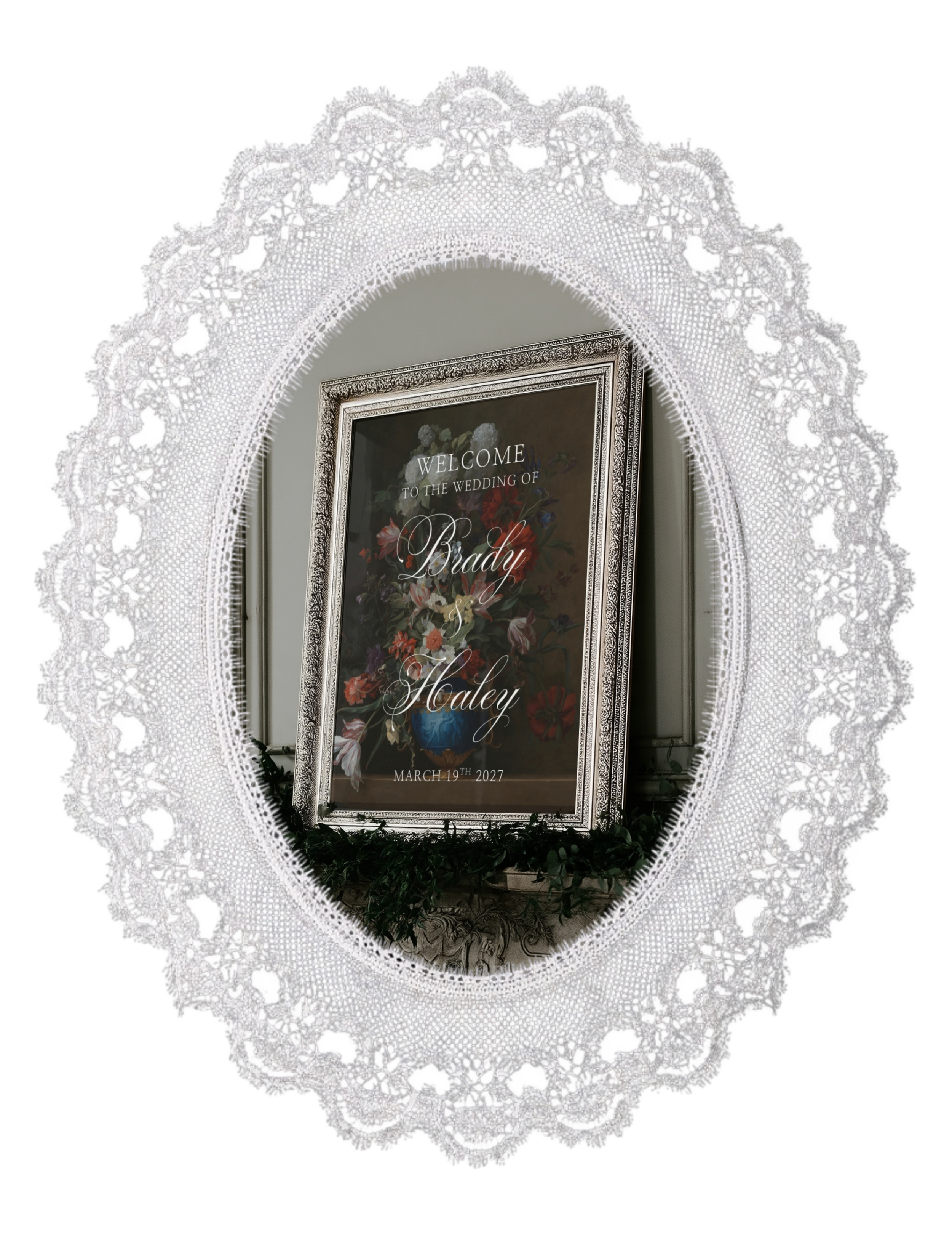 Oval lace with a silver ornate frame with a baroque floral print with 'Welcome to the wedding of Brady and Haley" on top.