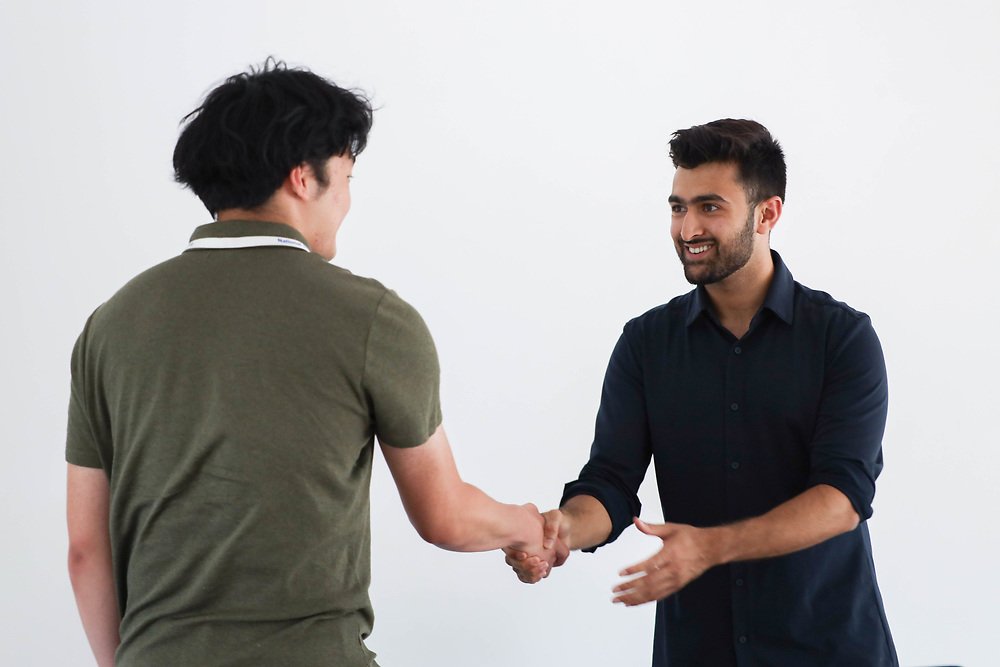 Khushal greeting a student