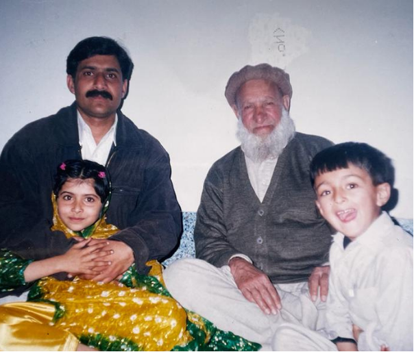 Khushal as a child with his family in Pakistan