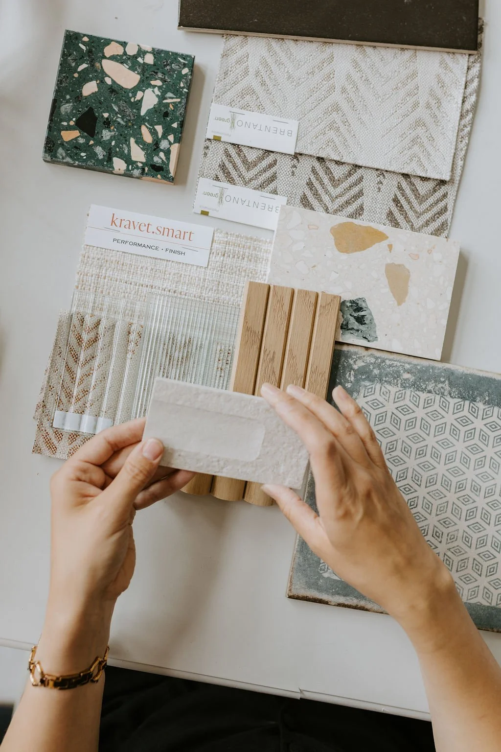 Interior designer selecting tile, fabric and material samples for a Vancouver home.