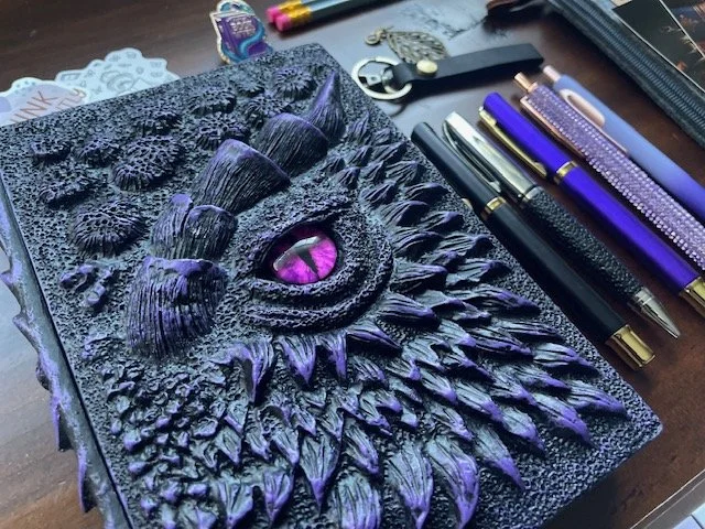 "Here there be dragons." A request from a book lover who enjoys an epic dragon story and loves all things purple. This journal is unlike one I've ever seen but it hit all the right marks.
