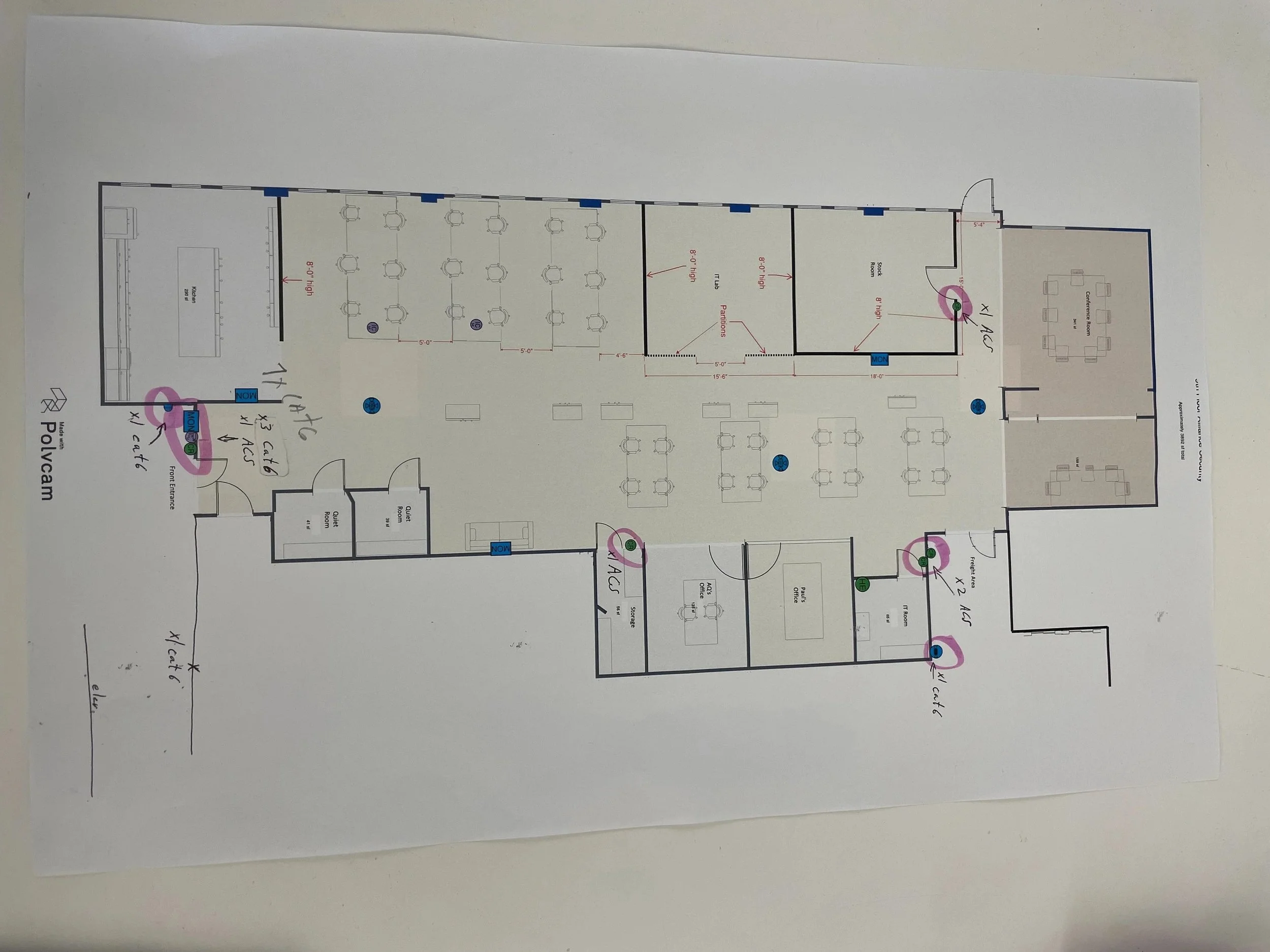 A detailed floor plan blueprint of a building layout showing various rooms, corridors, and structural details, with handwritten notes and markings.