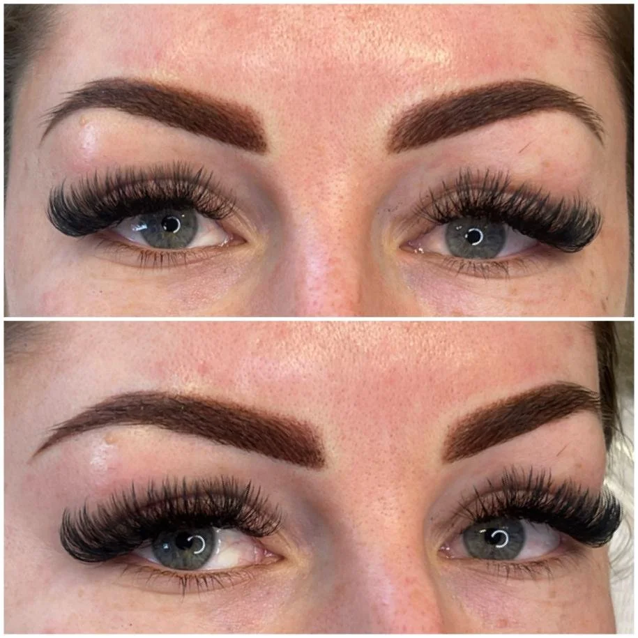 Close-up of a person's eyes with nude makeup, thick black eyelashes, and groomed eyebrows.