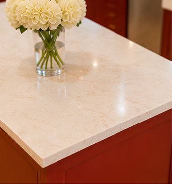 A vase of white flowers on a marble countertop